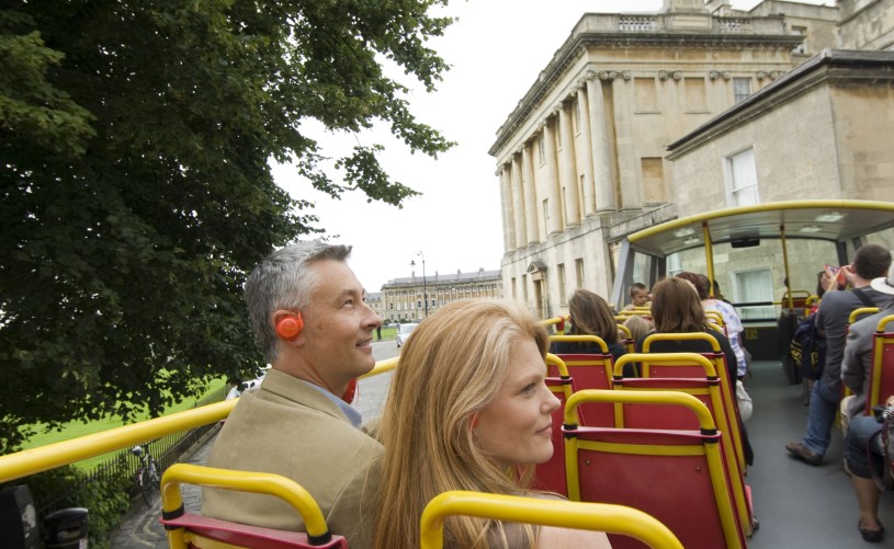 Couple on open top bus tour